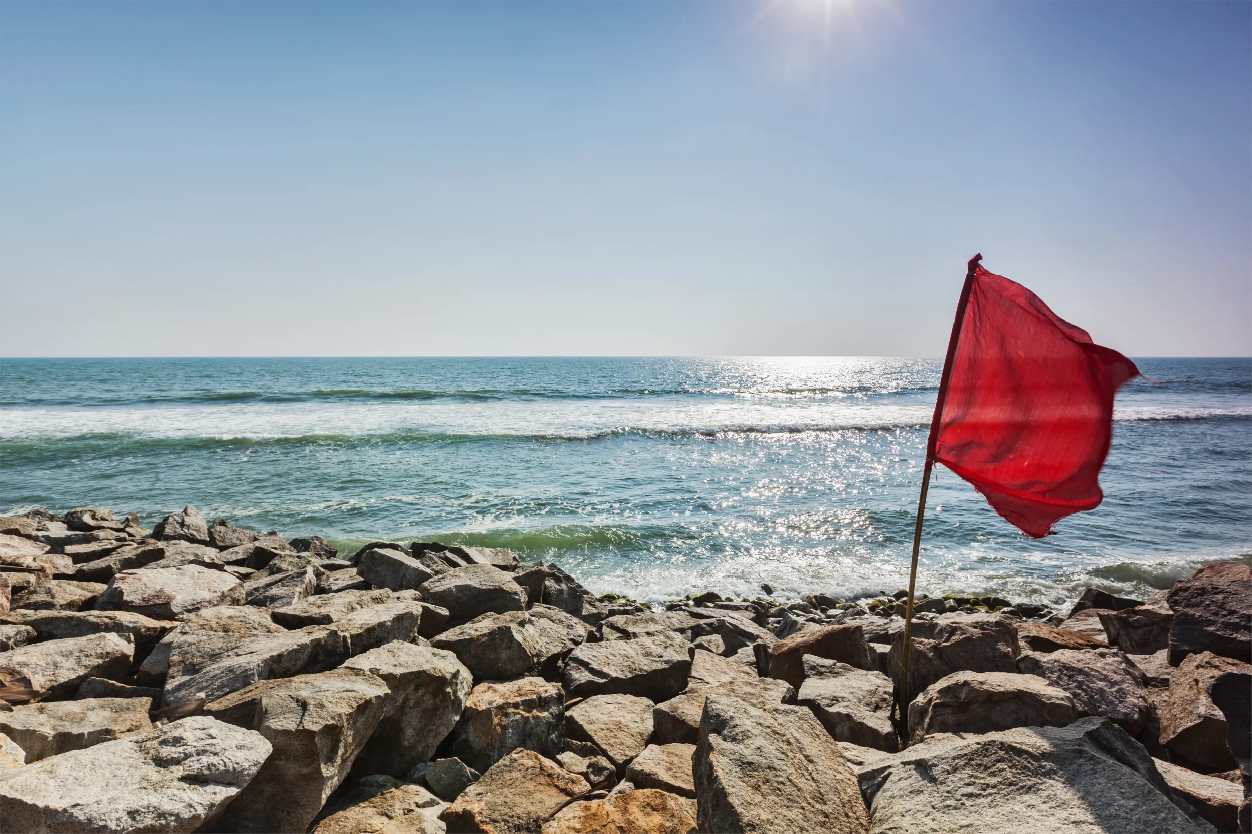 Red Flag On Rocky Beach 2024 10 17 20 53 33 Utc